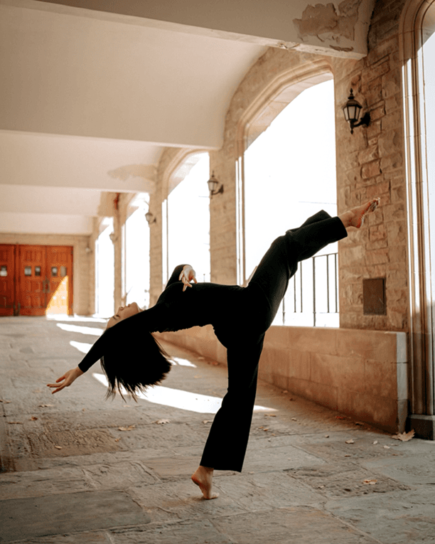 Rachel dancing — extension in a stone hallway